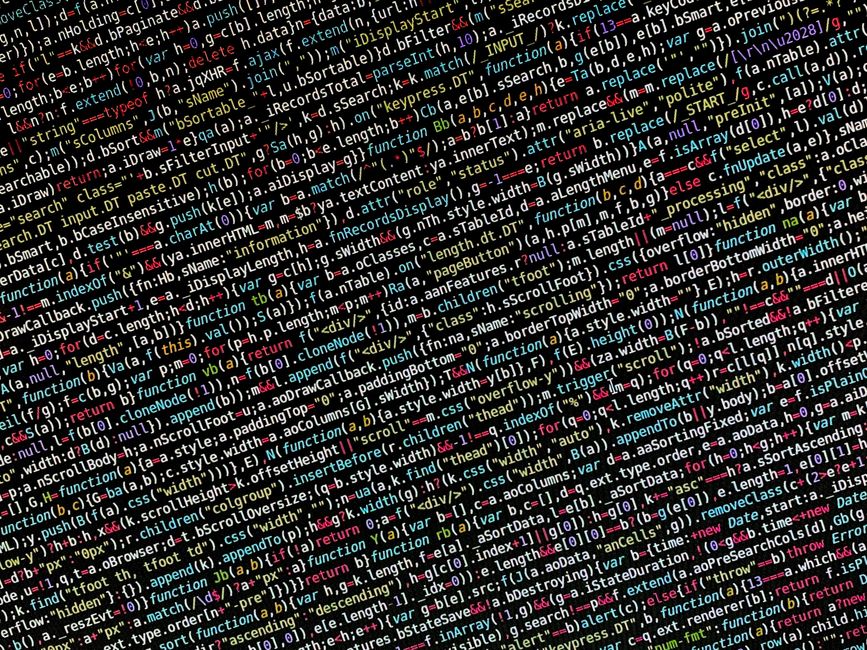 A close-up view of a computer screen displaying lines of colorful code in a text editor. The code features syntax highlighting with various colors such as blue, pink, yellow, and green, indicating dif